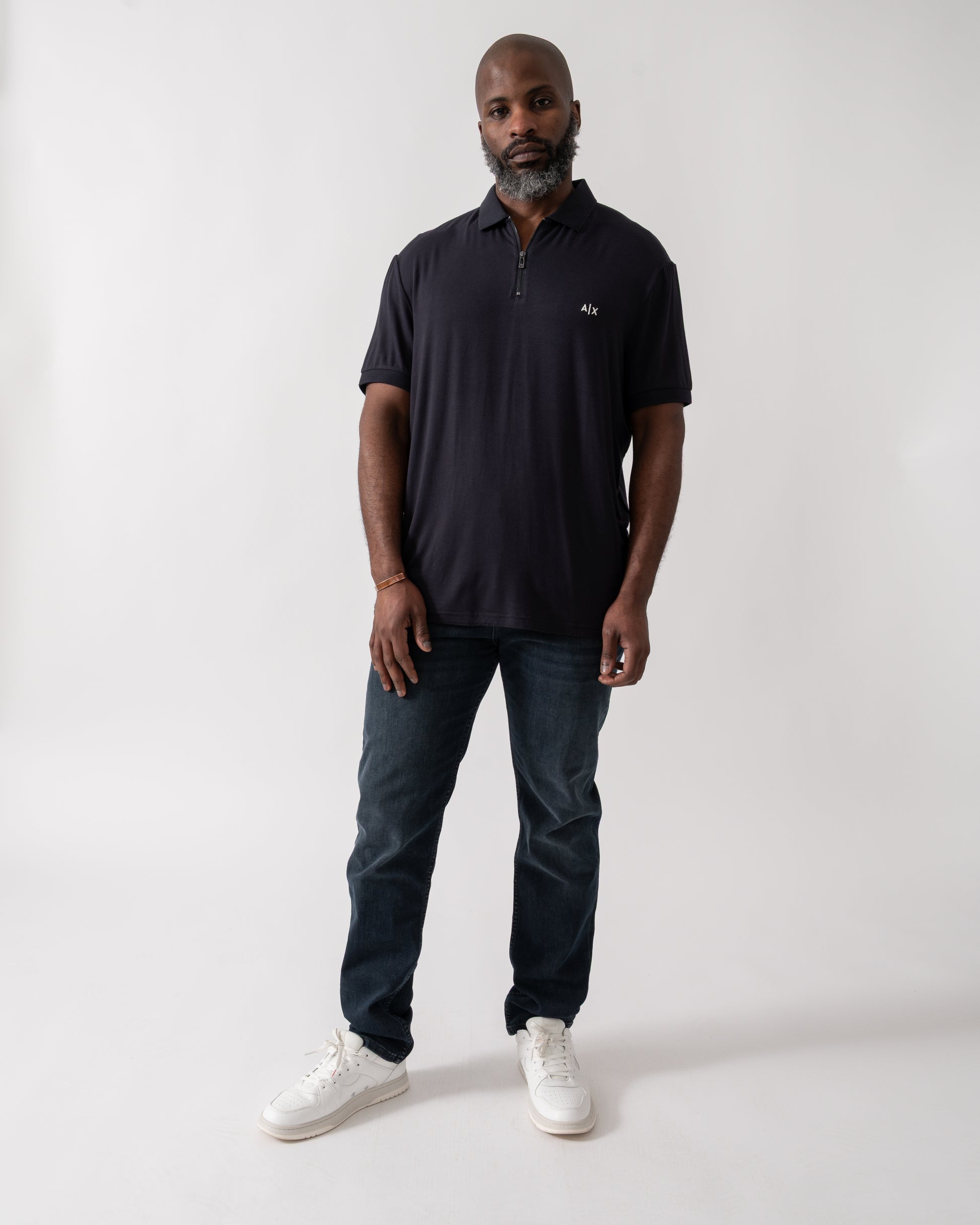 Full length of a Model wearing an Armani Exchange Mens Polo Shirt in Deep Navy