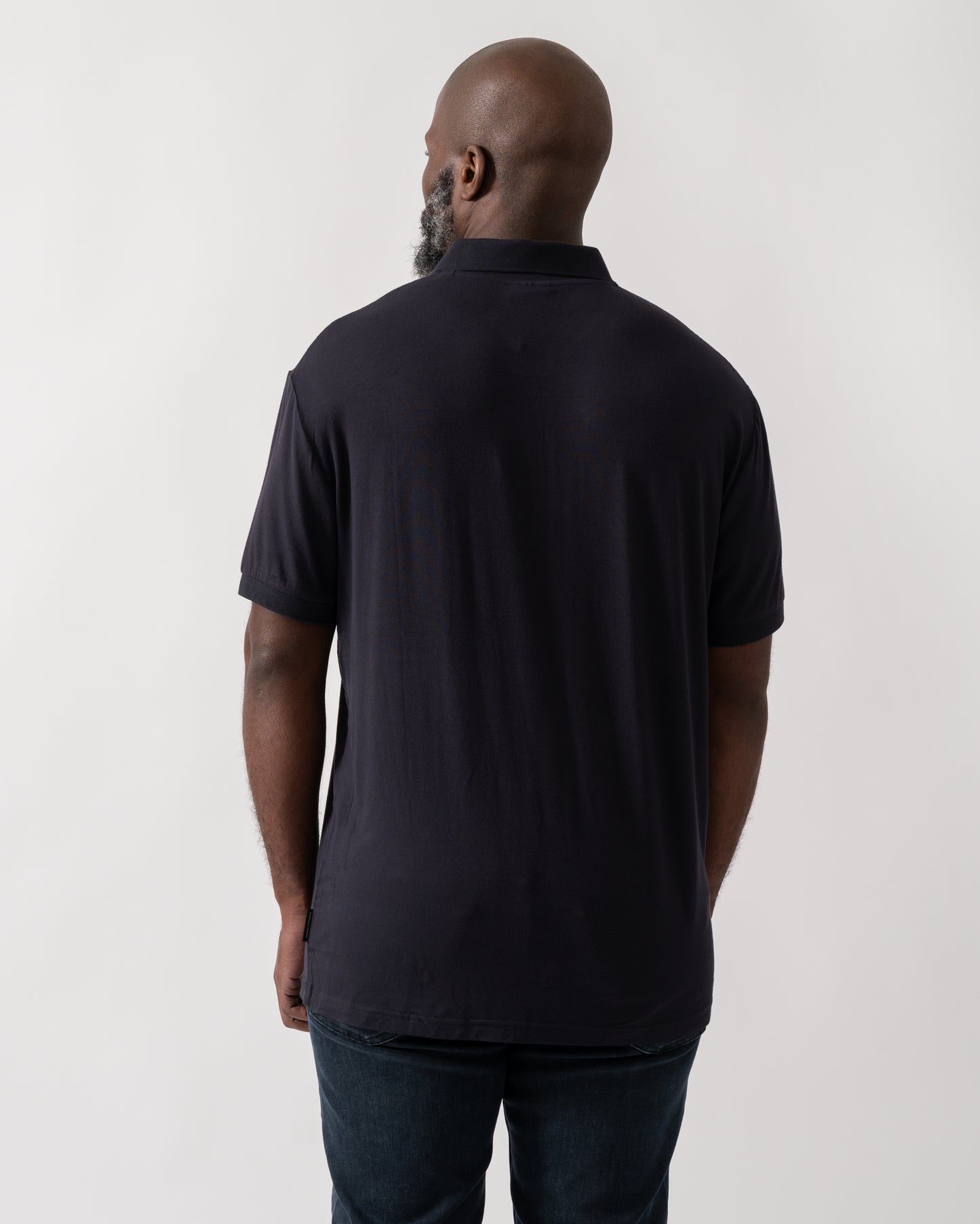 Back of a Model wearing an Armani Exchange Mens Polo Shirt in Deep Navy