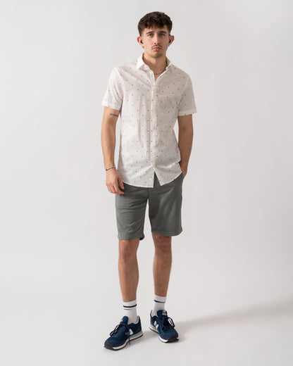 full length shot of a model wearing an Armani Exchange Mens Short Sleeve Shirt with Geometric Pattern in Off White F0198