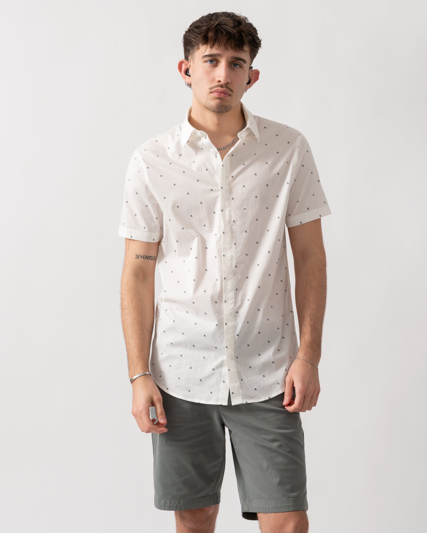 studio shot of a model wearing an Armani Exchange Mens Short Sleeve Shirt with Geometric Pattern in Off White F0198