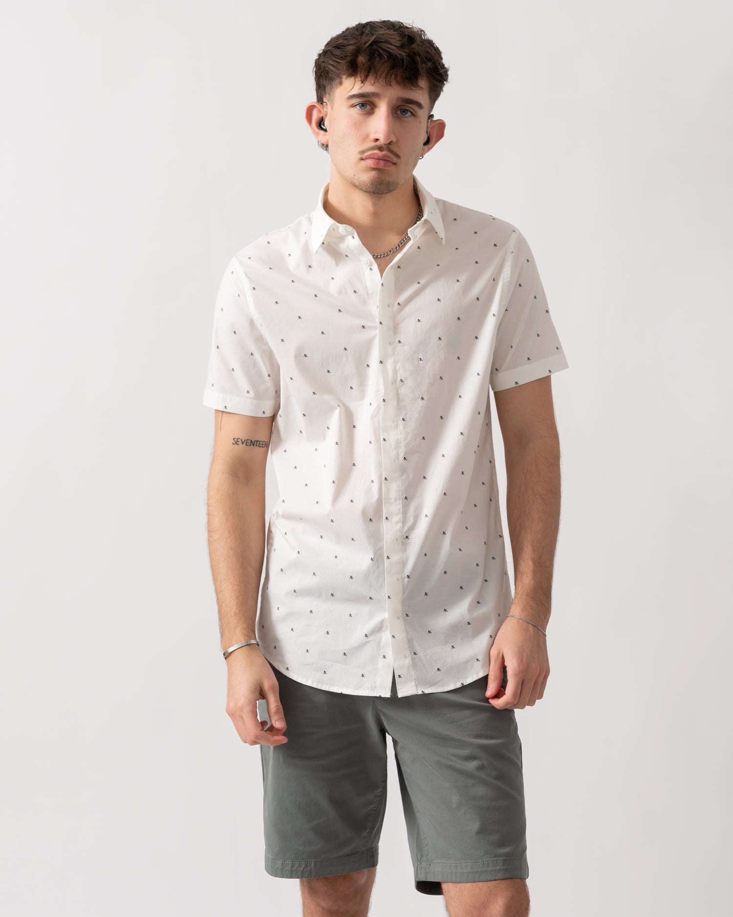 studio shot of a model wearing an Armani Exchange Mens Short Sleeve Shirt with Geometric Pattern in Off White F0198