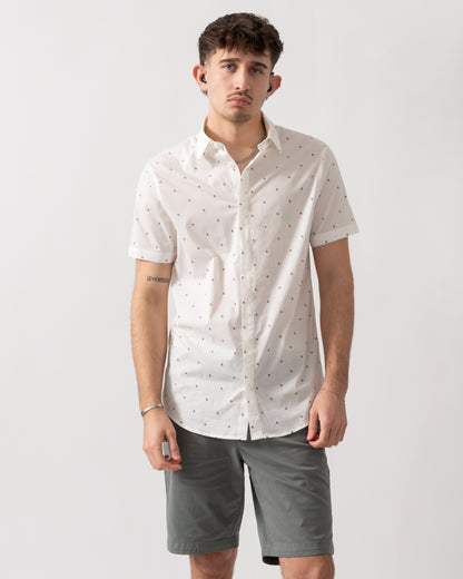 studio shot of a model wearing an Armani Exchange Mens Short Sleeve Shirt with Geometric Pattern in Off White F0198