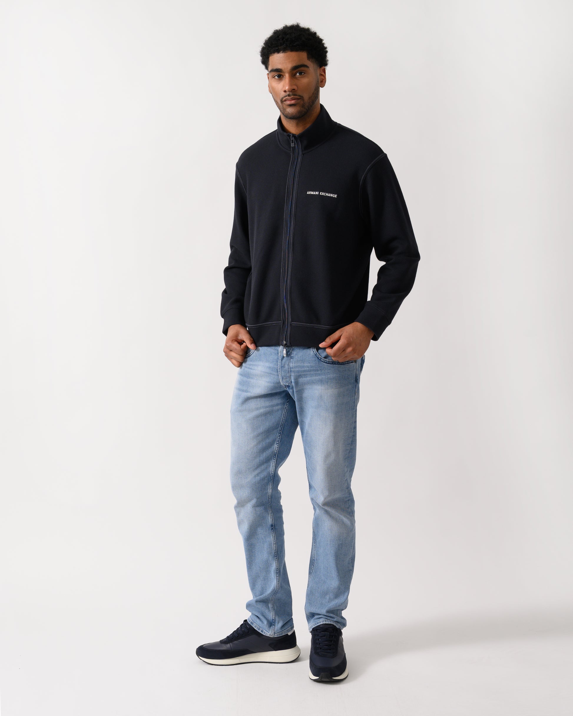 full length shot of a model wearing a Armani Exchange Mens Sweatshirt XM002327-AF21870 - Deep Navy UB101