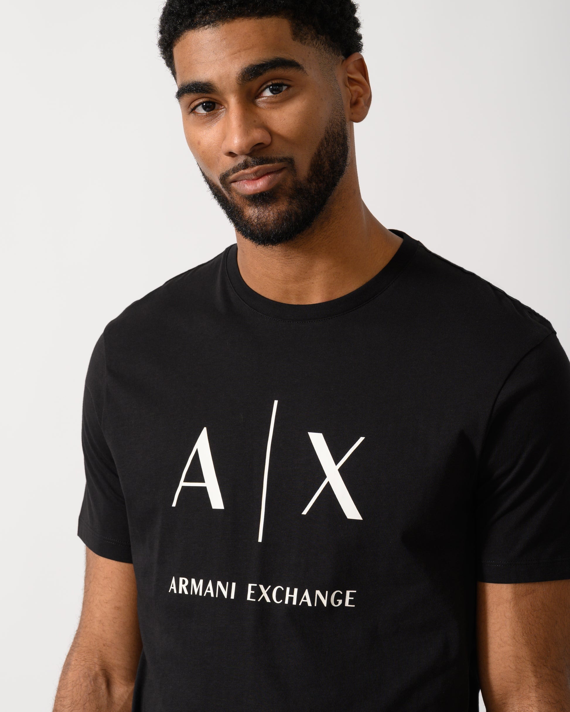 Detail shot of a Model wearing a Armani Exchange Mens T-Shirt in Black