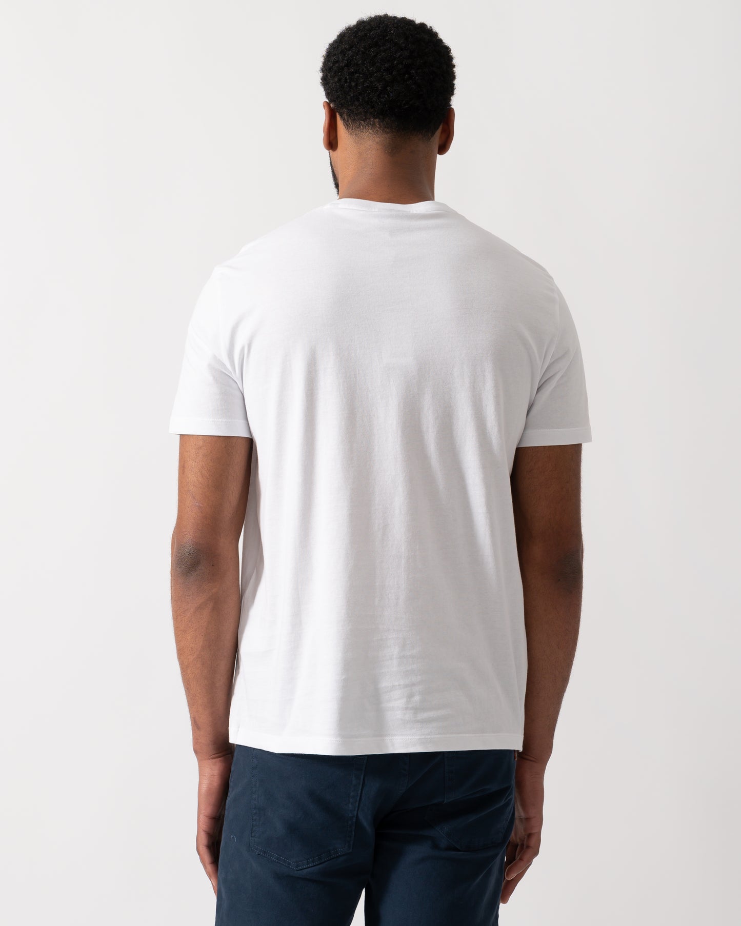 back shot of a Model wearing an Armani Exchange Mens T-Shirt in White