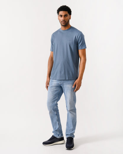 full length shot of a model wearing a Armani Exchange Mens T-Shirt with Small Milano-New York Logo in China Blue