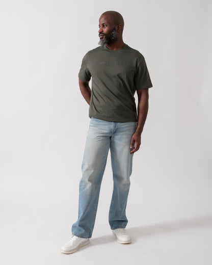 Full length shot of a Model wearing an Armani Exchange Mens T-Shirt with Tonal Milano/New York Logo in Chimera