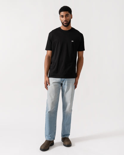 Model wearing Armani Exchange Mens A|X Monogram T-Shirt in Black UC001 - Full Length