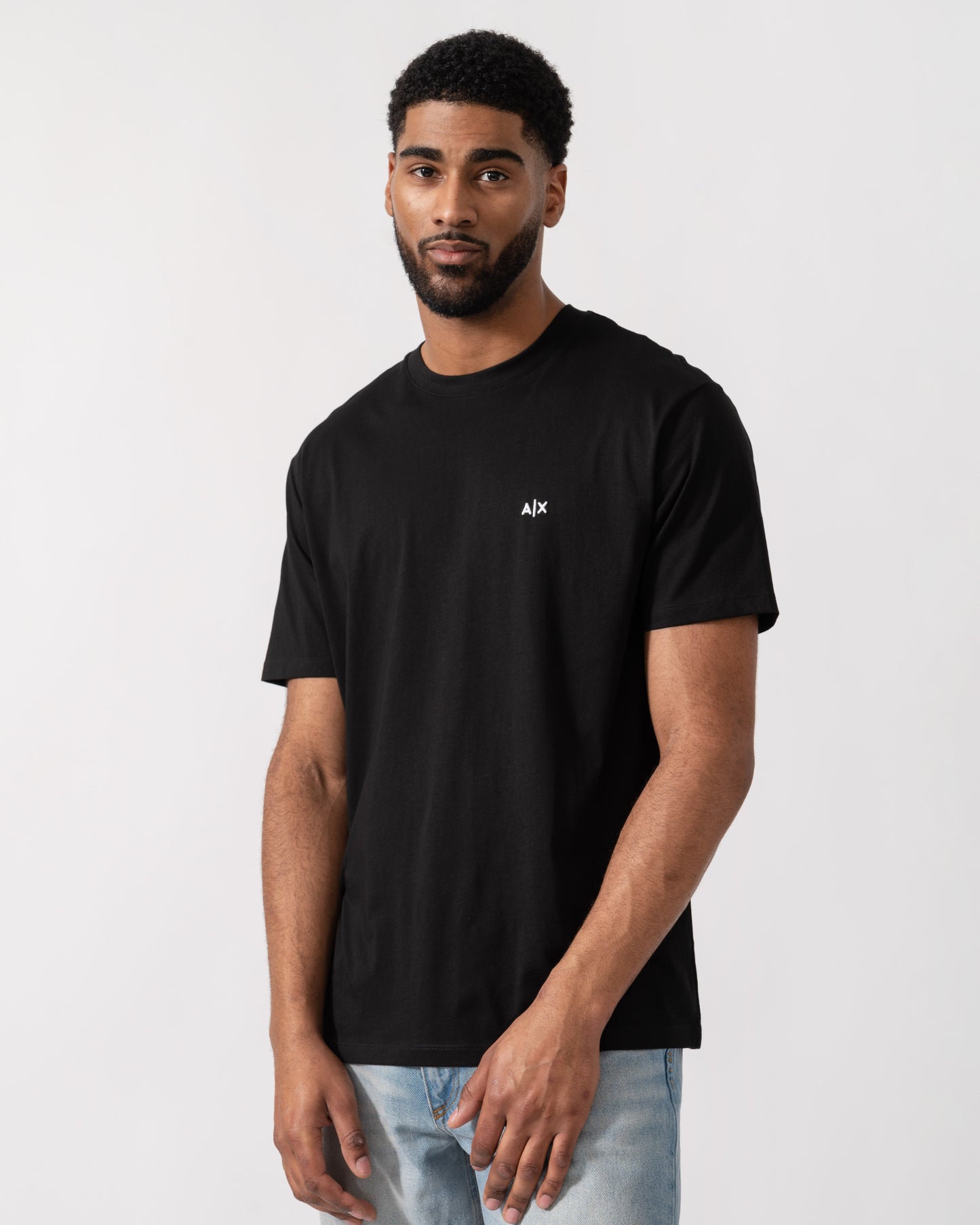 Model wearing Armani Exchange Mens A|X Monogram T-Shirt in Black UC001 - Main