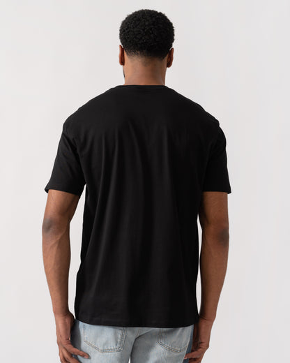 Model wearing Armani Exchange Mens A|X Monogram T-Shirt in Black UC001 - back