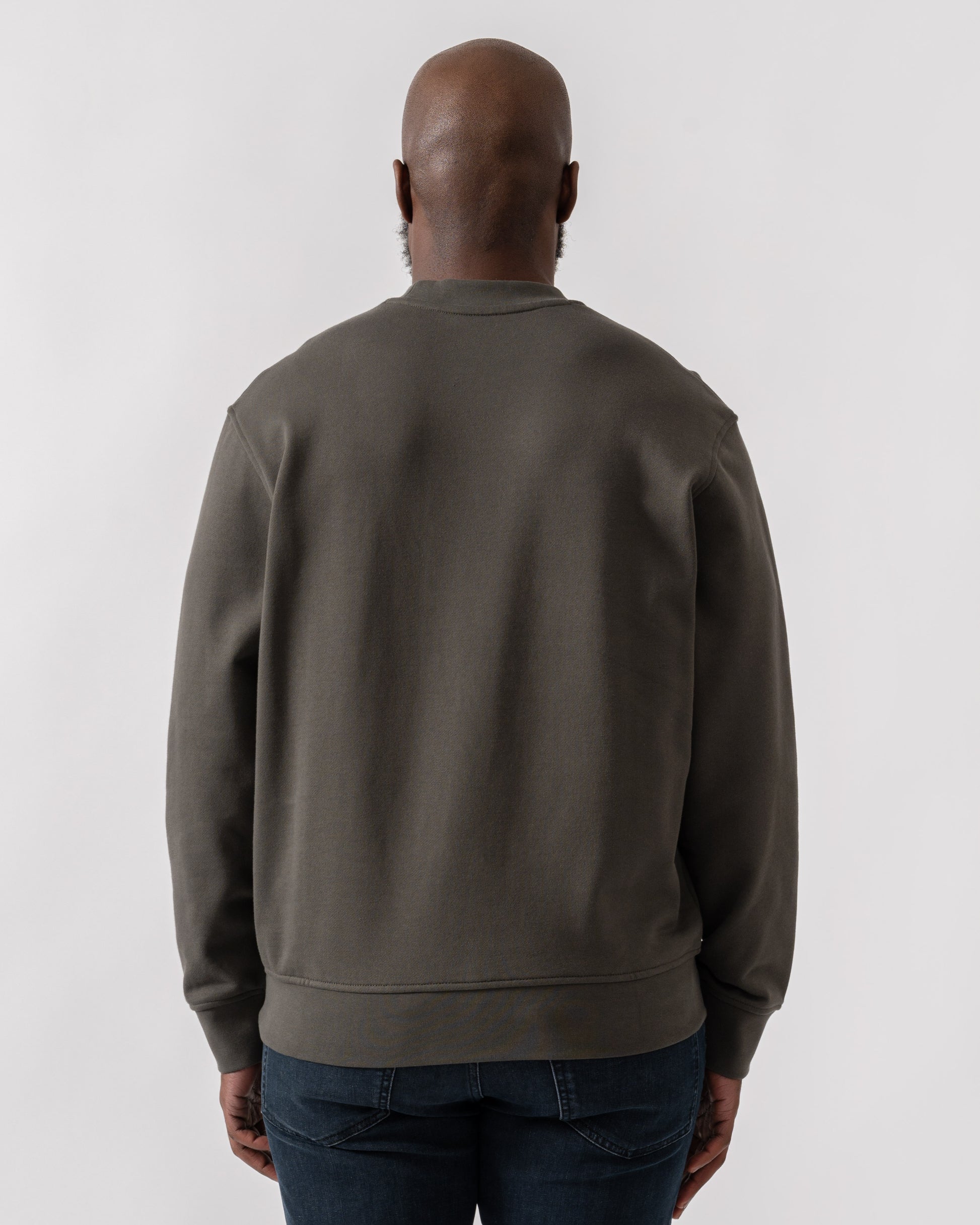 Model wearing Armani Exchange Mens Crew Neck Sweatshirt with Tonal Milano/New York Logo in Chimera M8317 - back