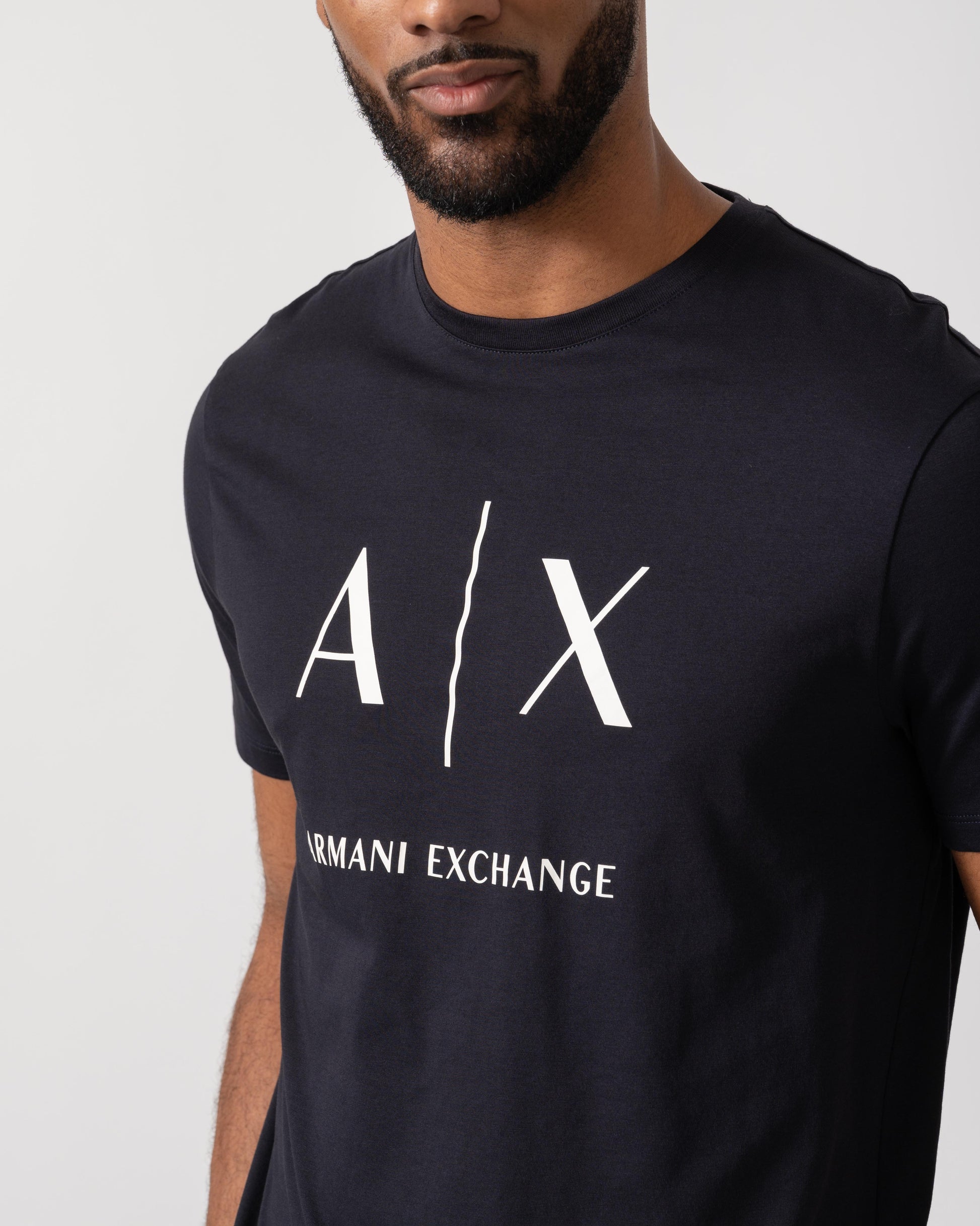 Model wearing Armani Exchange AX Logo T-Shirt in Deep Navy UB101 - Detail