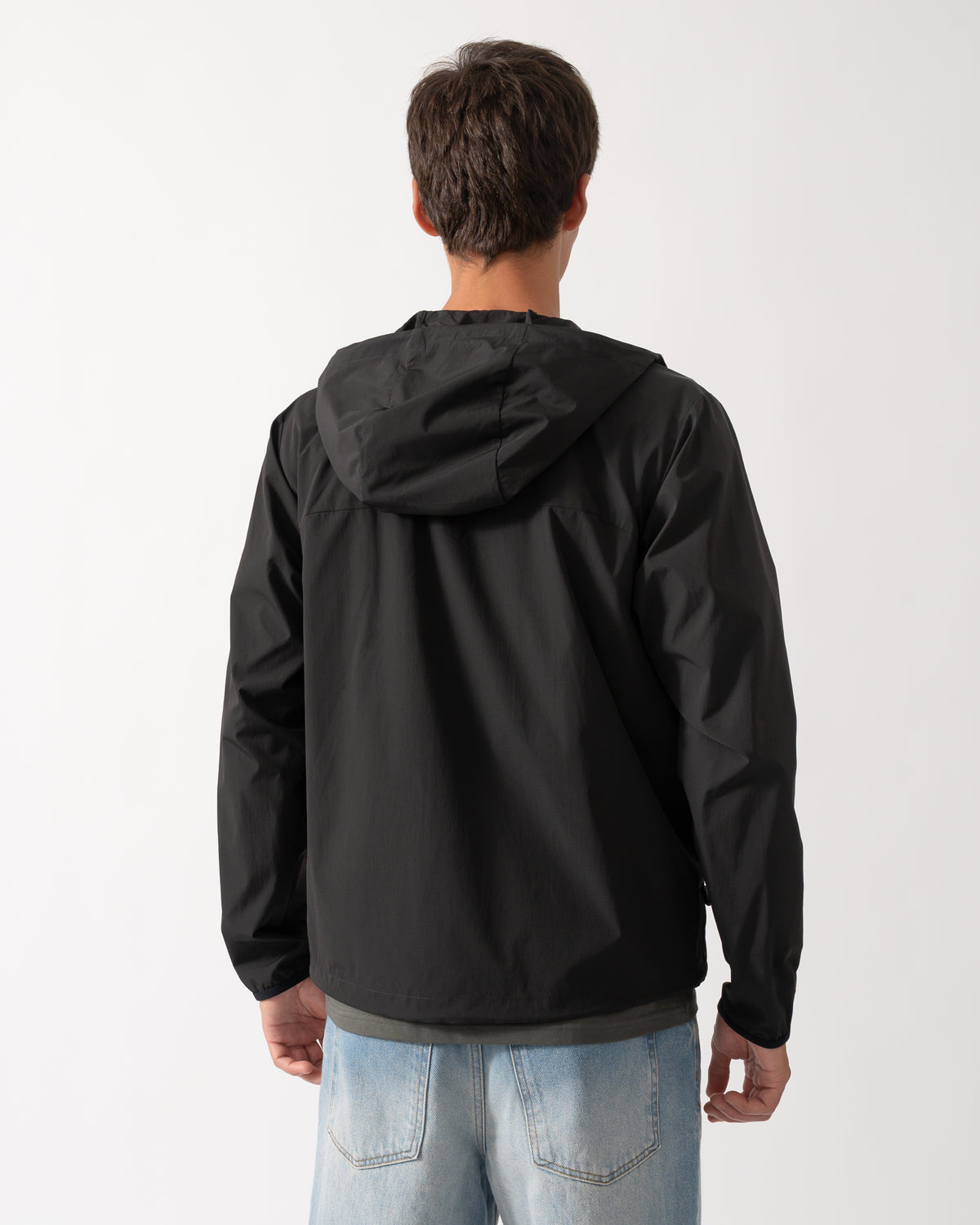 back of a model wearing a BOSS Green Airynix Mens Hooded Jacket in Black 001
