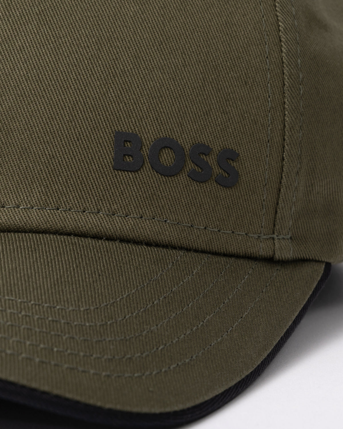 logo detail of a BOSS Green Bold Mens Logo-Print Cap In Cotton Twill in Open Green 398
