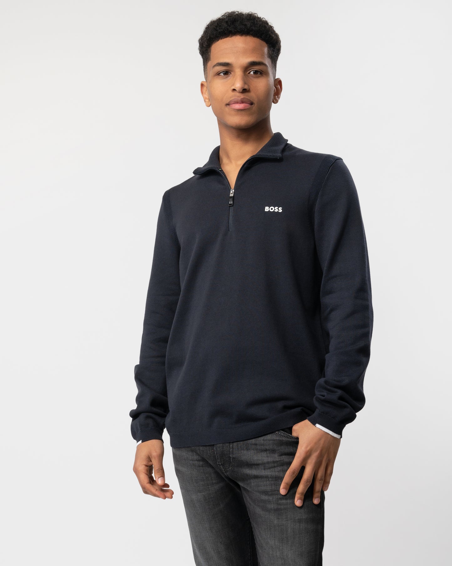 Mid shot of a Model wearing a BOSS Green Ever-X Mens Cotton Blend Zip-Neck Sweater with Logo Print in Dark Blue