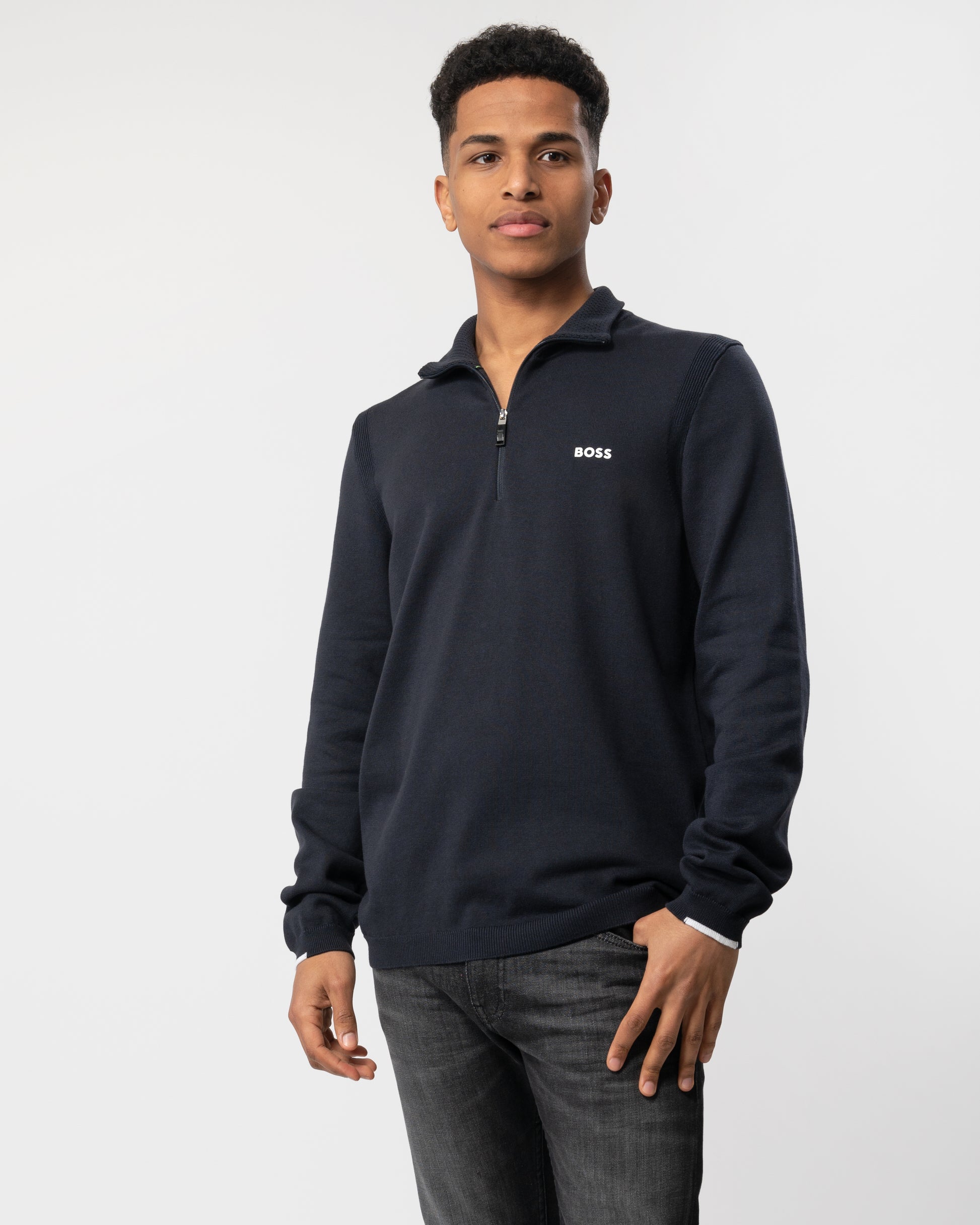 Mid shot of a Model wearing a BOSS Green Ever-X Mens Cotton Blend Zip-Neck Sweater with Logo Print in Dark Blue