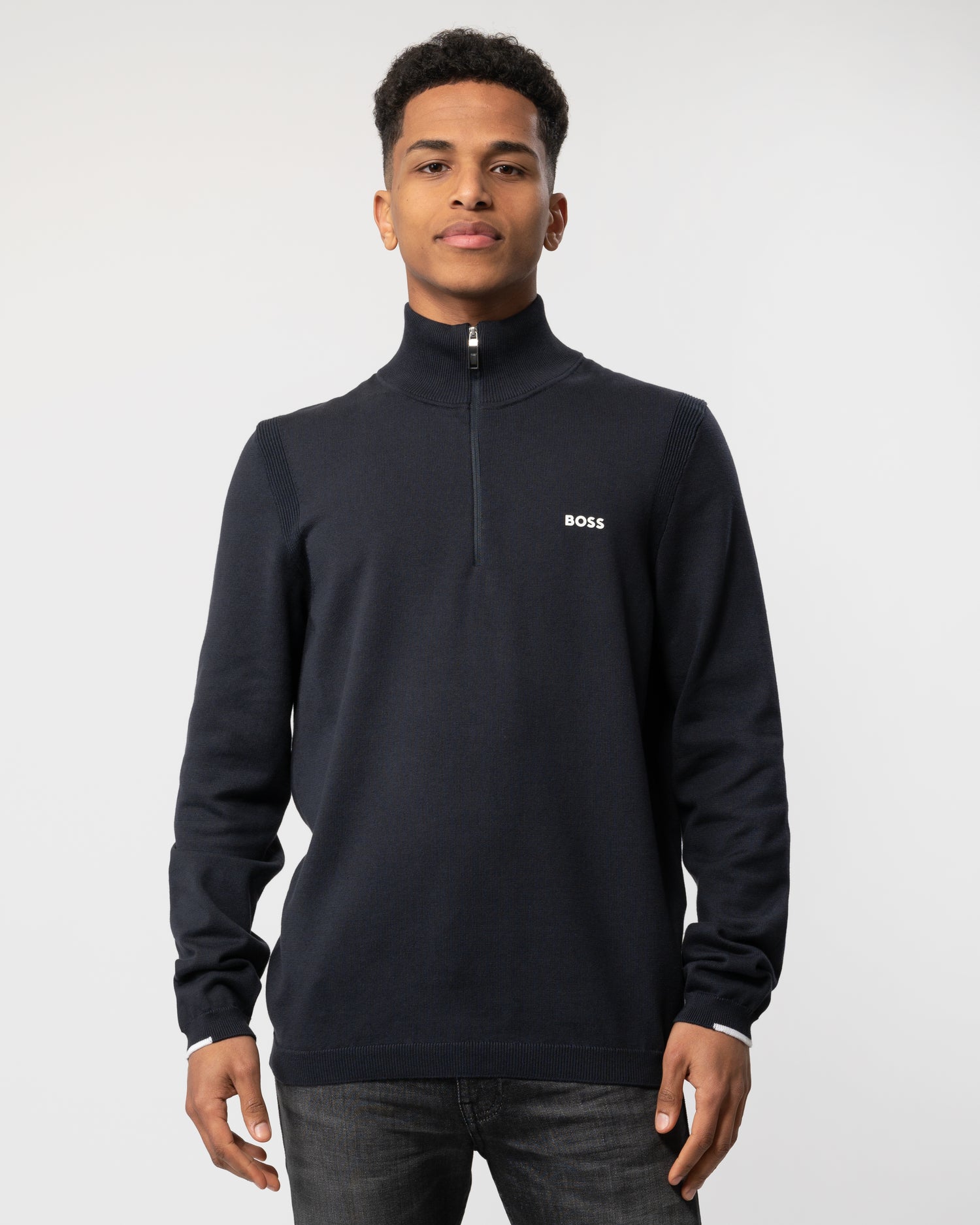 Model wearing a BOSS Green Ever-X Mens Cotton Blend Zip-Neck Sweater with Logo Print in Dark Blue
