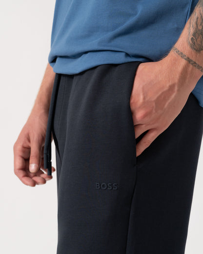 Close up of the BOSS Green Hadiko Mens Stretch-cotton track pants with puff-print logo - Dark Blue 402