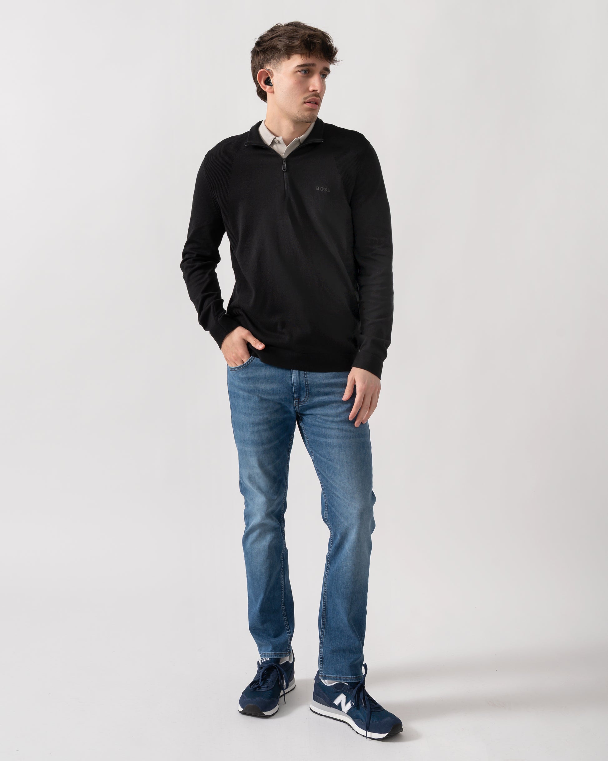 full length shot of a model wearing a BOSS Green Momentum-Lite Mens quarter Zip Funnel Neck Jumper in Black 001