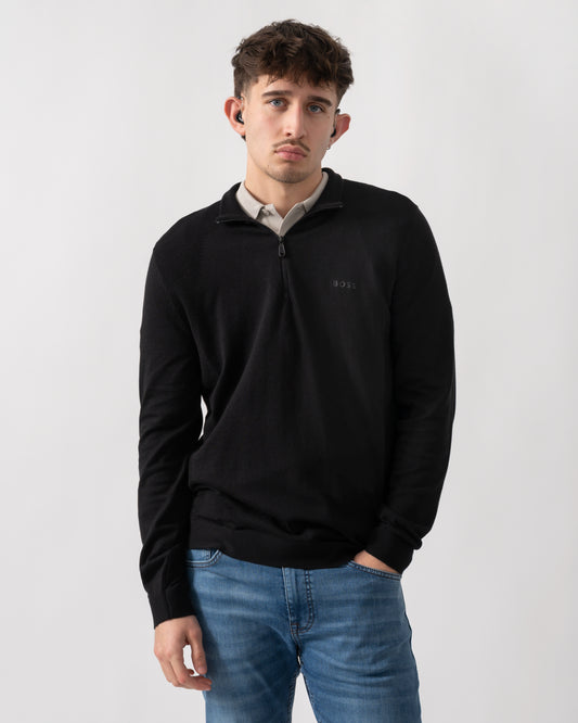 studio shot of a model wearing a BOSS Green Momentum-Lite Mens quarter Zip Funnel Neck Jumper in Black 001