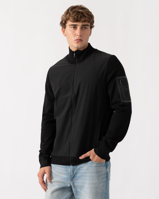 Man wearing BOSS Green Momentum-X Mens Hybrid Jacket With Knitted Sleeves - Black 001