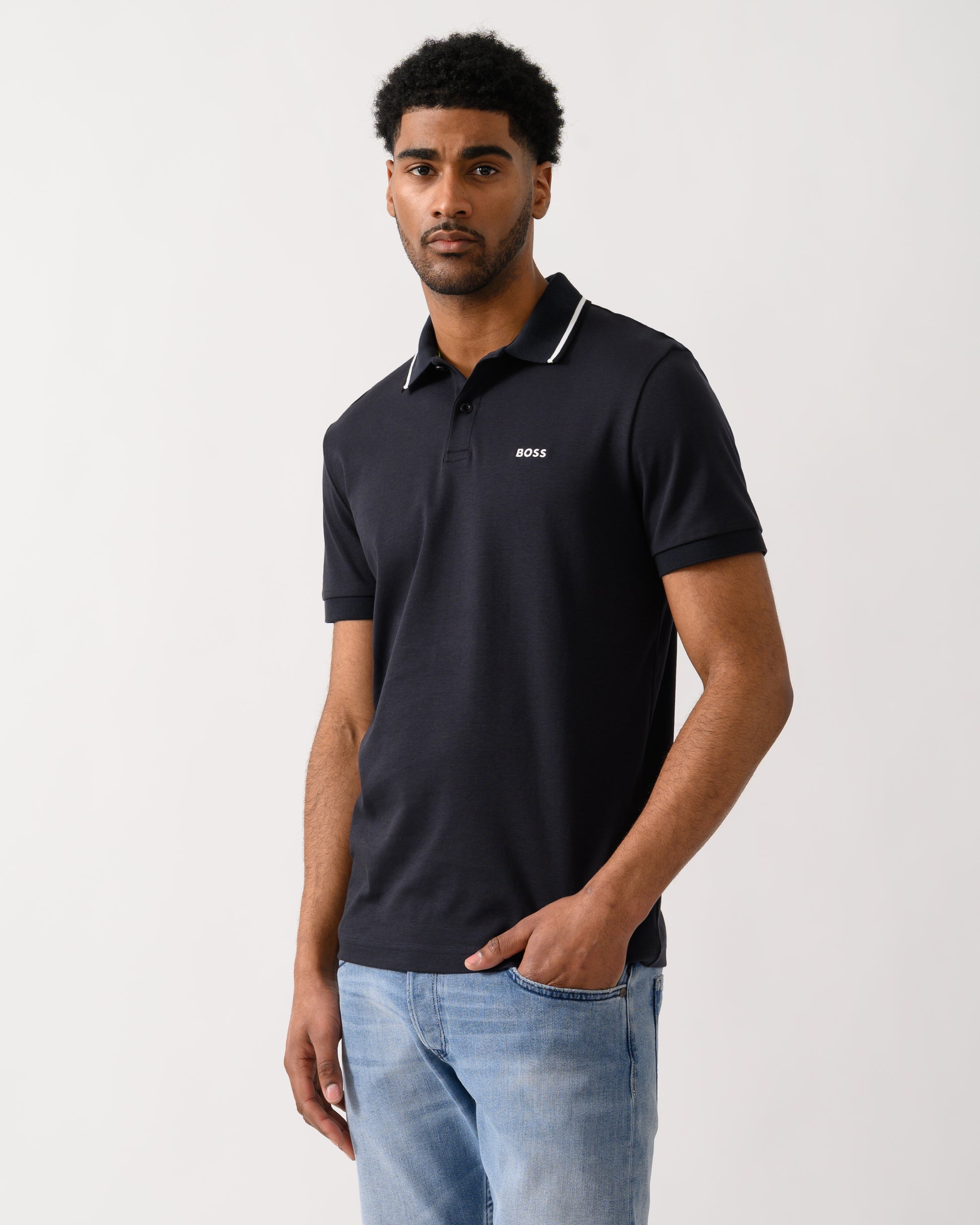Model wearing a BOSS Green Paddy Mens Slim-Fit Polo Shirt in Interlock Cotton in Dark Blue 402
