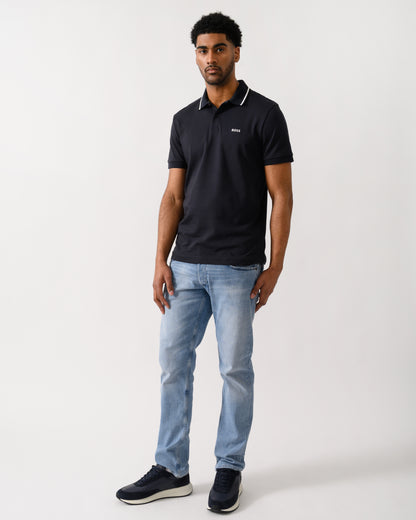 full length shot of a Model wearing a BOSS Green Paddy Mens Slim-Fit Polo Shirt in Interlock Cotton in Dark Blue 402