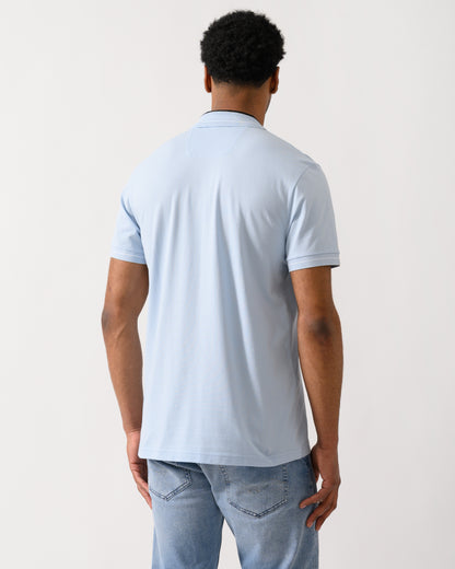 back shot of a Model wearing a BOSS Green PL_Member Mens Short Sleeve Polo Shirt in Open Blue 460
