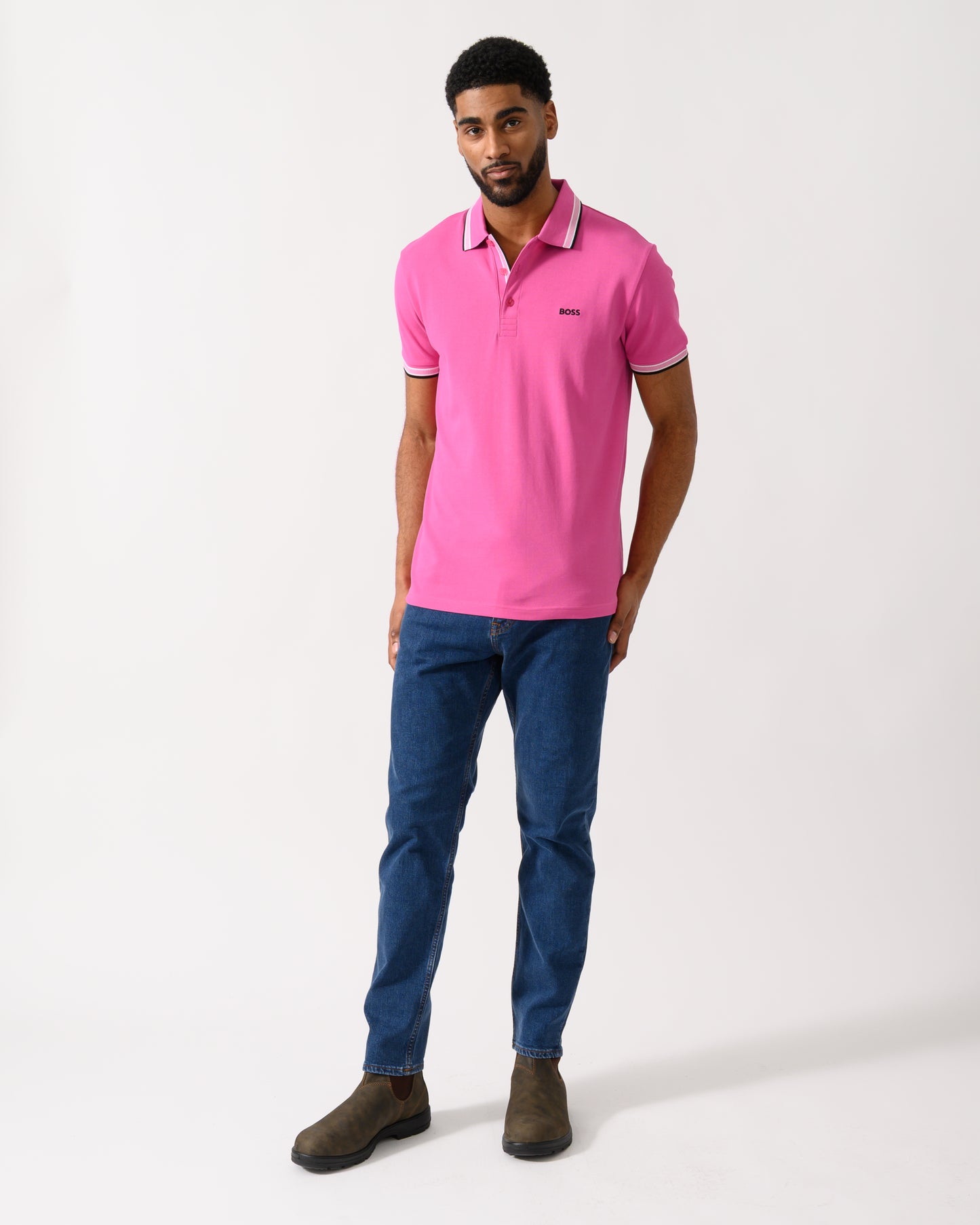 Full length shot of a model wearing a BOSS Green Paddy Mens Cotton-Piqué Polo Shirt with Contrast Logo in Bright Pink