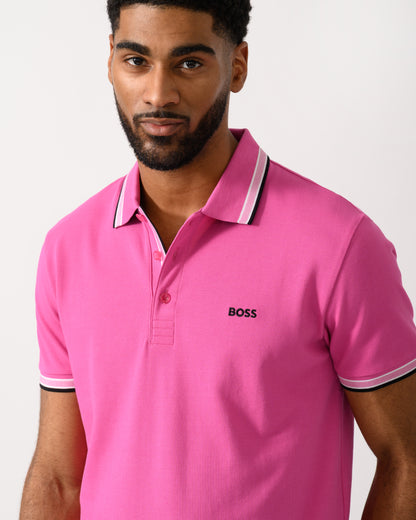 detail shot of a model wearing a BOSS Green Paddy Mens Cotton-Piqué Polo Shirt with Contrast Logo in Bright Pink