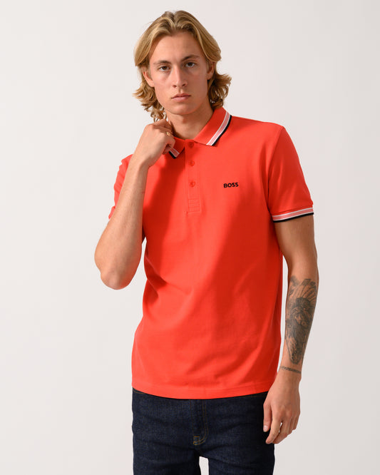 studio photograph of a model wearing a BOSS Green Paddy Mens Cotton-Piqué Polo Shirt with Contrast Logo in Bright Red 620