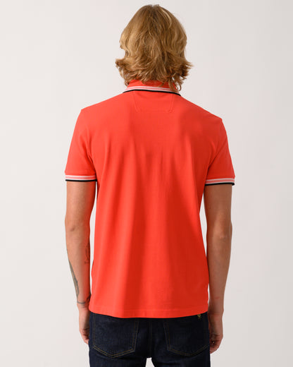studio photograph of back of a model wearing a BOSS Green Paddy Mens Cotton-Piqué Polo Shirt with Contrast Logo in Bright Red 620