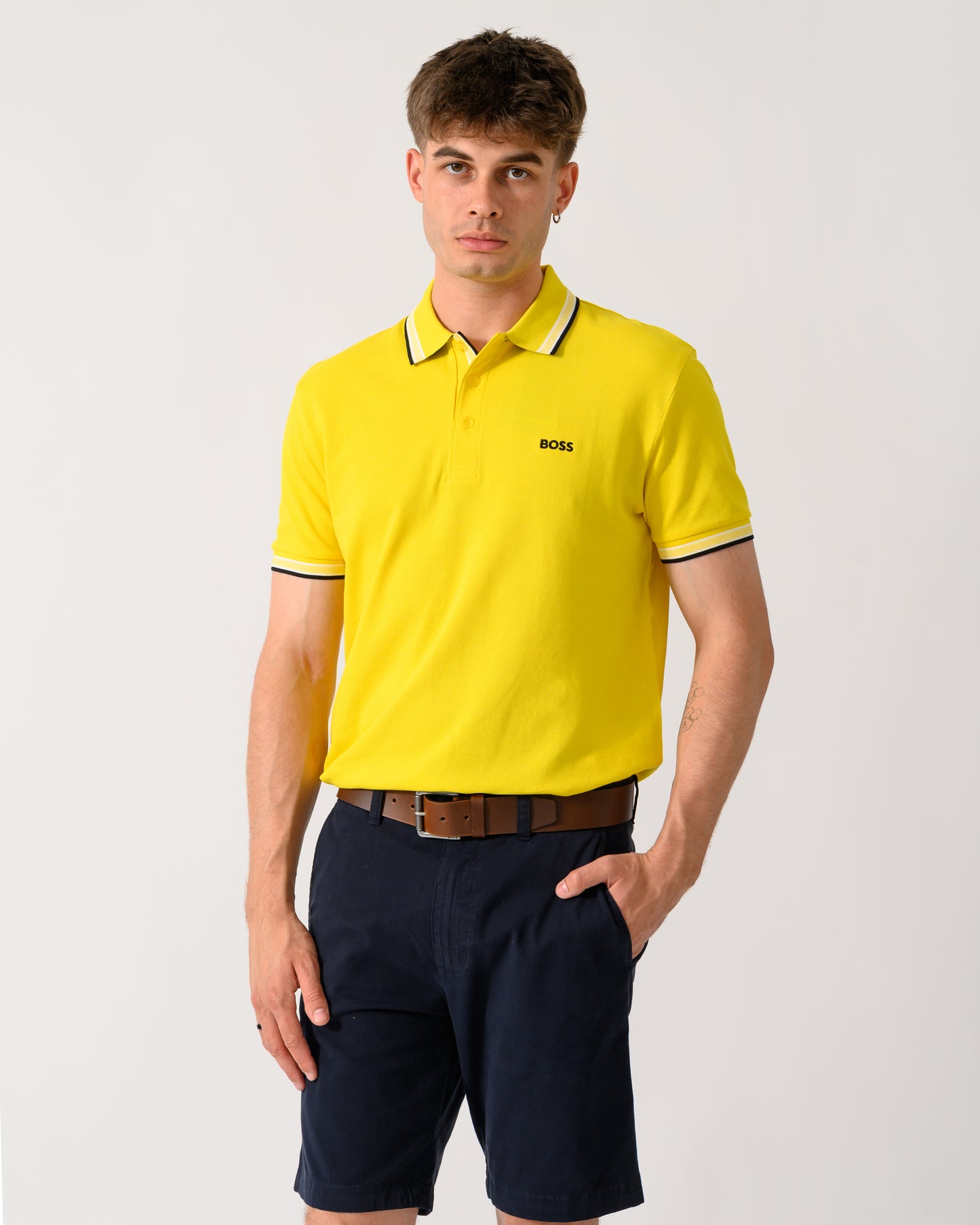 model wearing a BOSS Green Paddy Mens Cotton-Piqué Polo Shirt with Contrast Logo in Bright Yellow 739