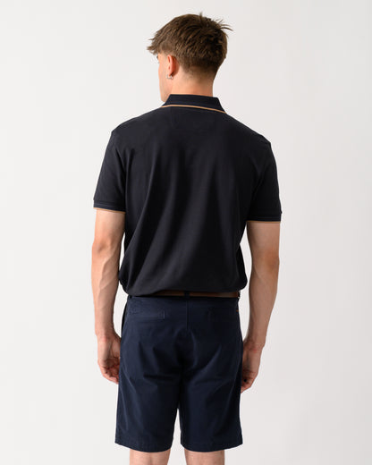 back shot of a model wearing a BOSS Green Paddy Mens Cotton-Piqué Polo Shirt with Contrast Logo in Dark Blue 401