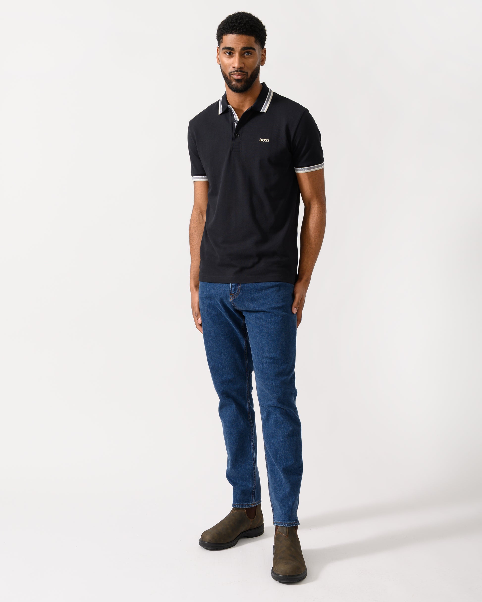 Full length shot of a Model wearing a BOSS Green Paddy Mens Cotton-Piqué Polo Shirt with Contrast Logo in Medium Blue