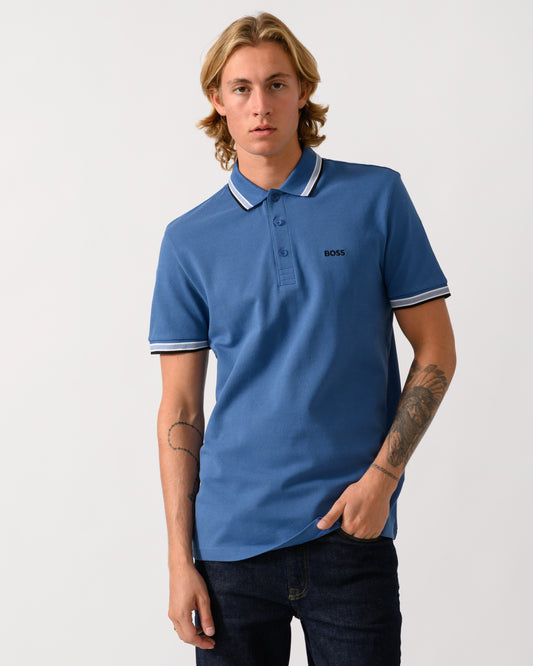 a studio photograph of a model wearing a BOSS Green Paddy Mens Cotton-Piqué Polo Shirt with Contrast Logo  in Medium Blue 428