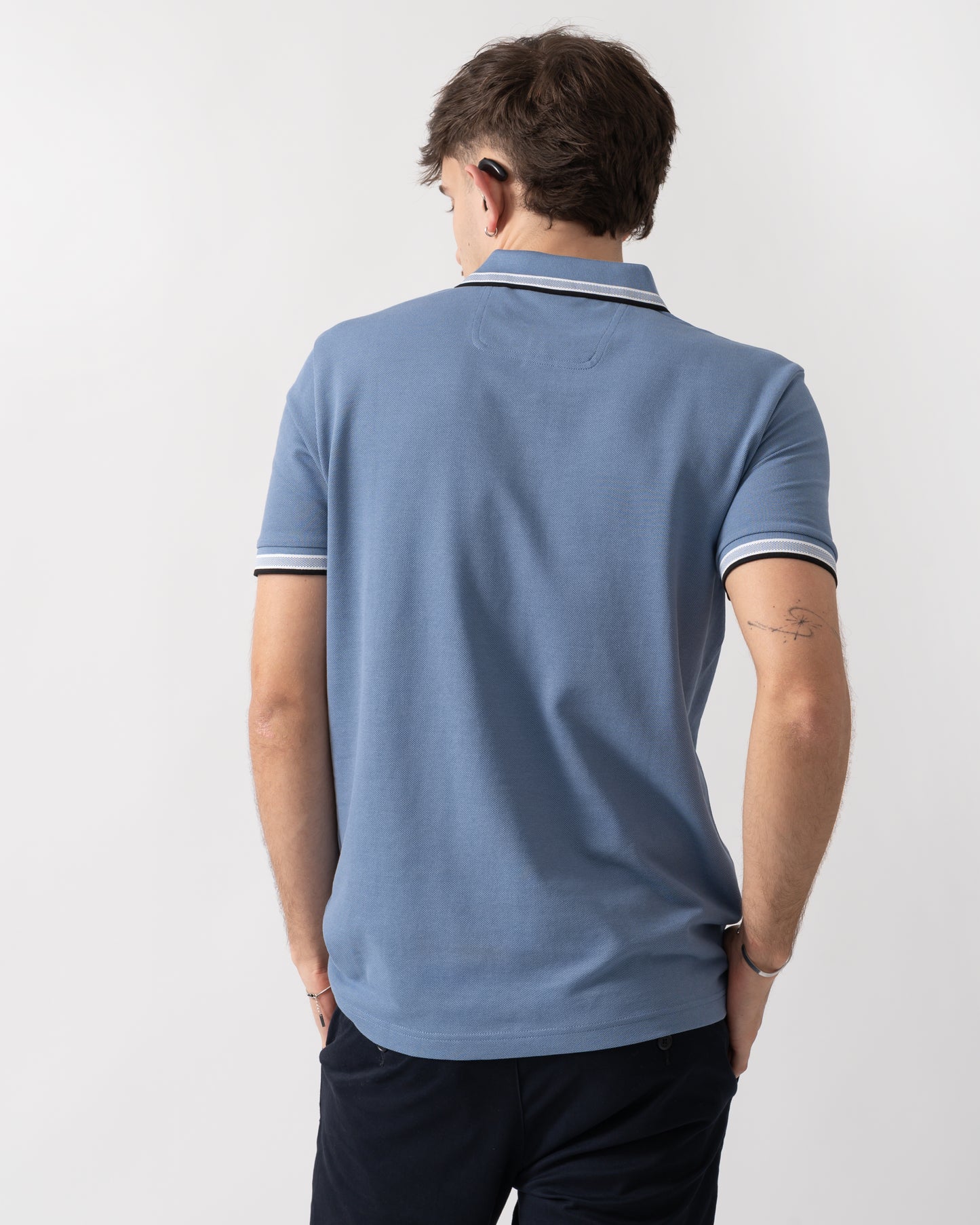 back shot of a model wearing a BOSS Green Paddy Mens Cotton-Piqué Polo Shirt with Contrast Logo in Open Blue 462