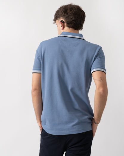 back shot of a model wearing a BOSS Green Paddy Mens Cotton-Piqué Polo Shirt with Contrast Logo in Open Blue 462