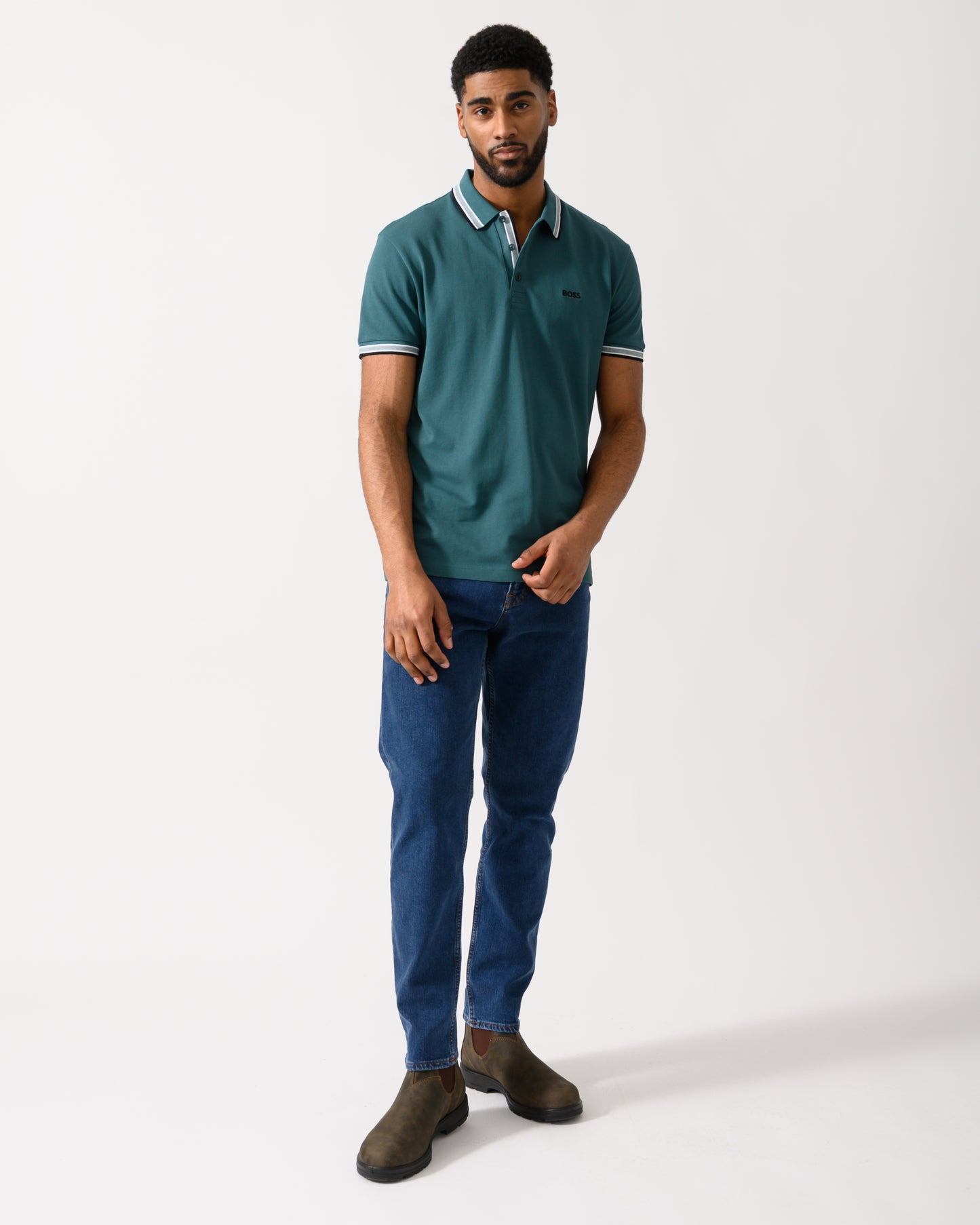 Full length shot of a model wearing a BOSS Green Paddy Mens Cotton-Piqué Polo Shirt with Contrast Logo in Open Green