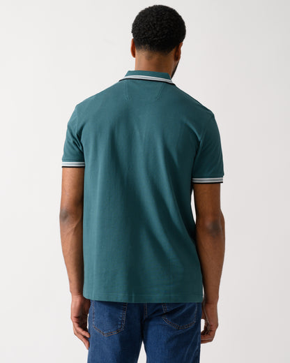 back shot of a model wearing a BOSS Green Paddy Mens Cotton-Piqué Polo Shirt with Contrast Logo in Open Green