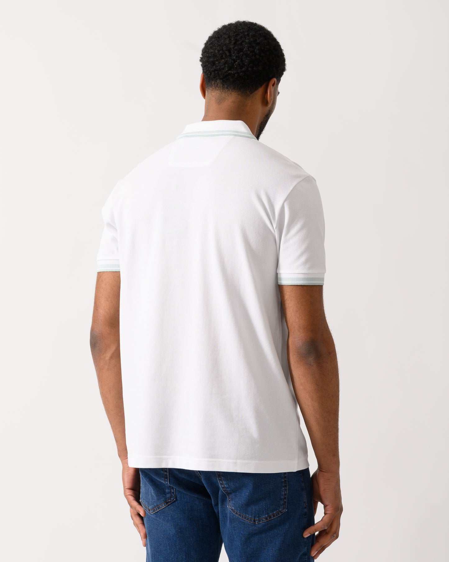 back shot of a Model wearing a BOSS Green Paddy Mens Cotton-Piqué Polo Shirt with Contrast Logo in Open White