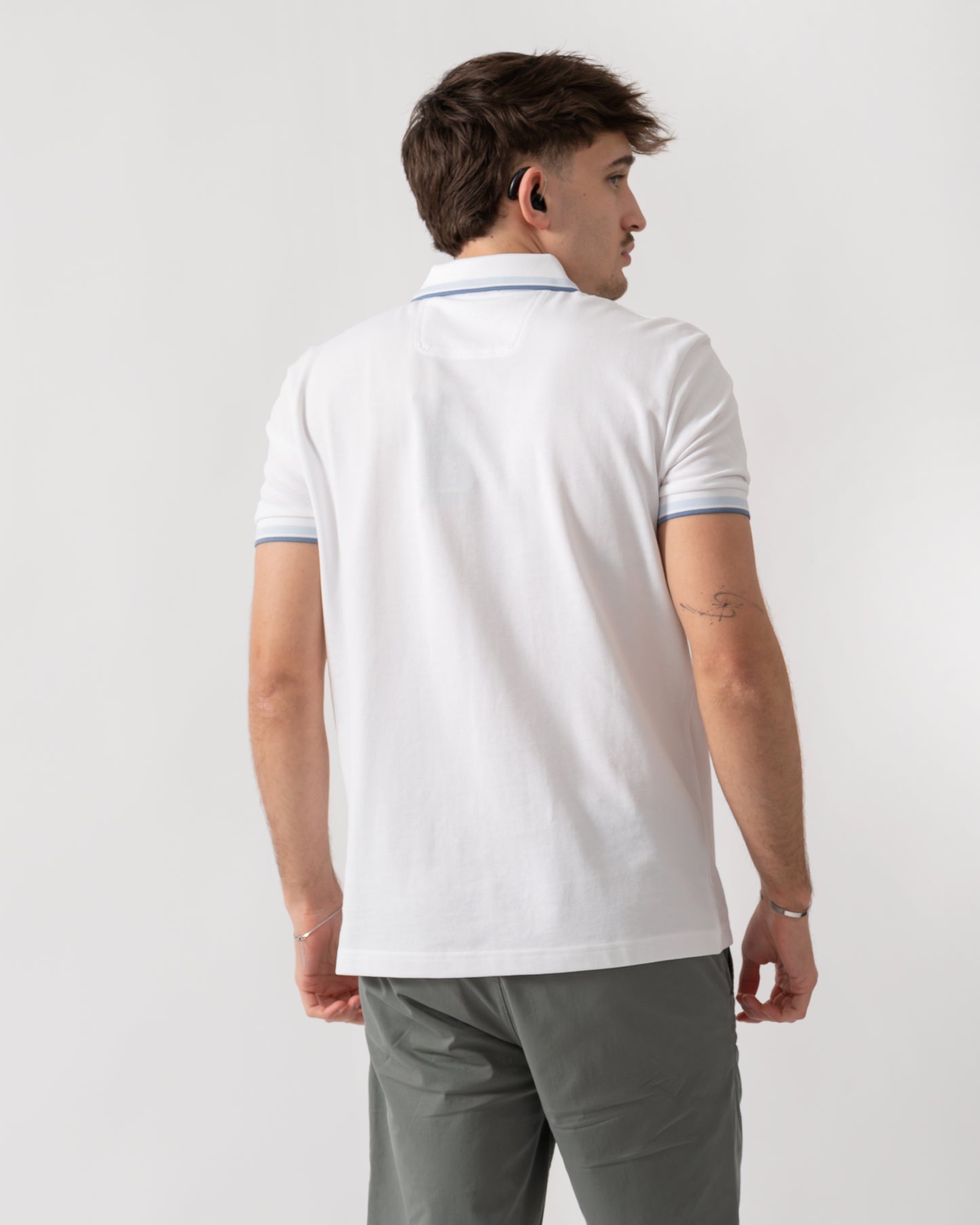 back shot of a model wearing a BOSS Green Paddy Mens Cotton-Piqué Polo Shirt with Contrast Logo in Open White 115