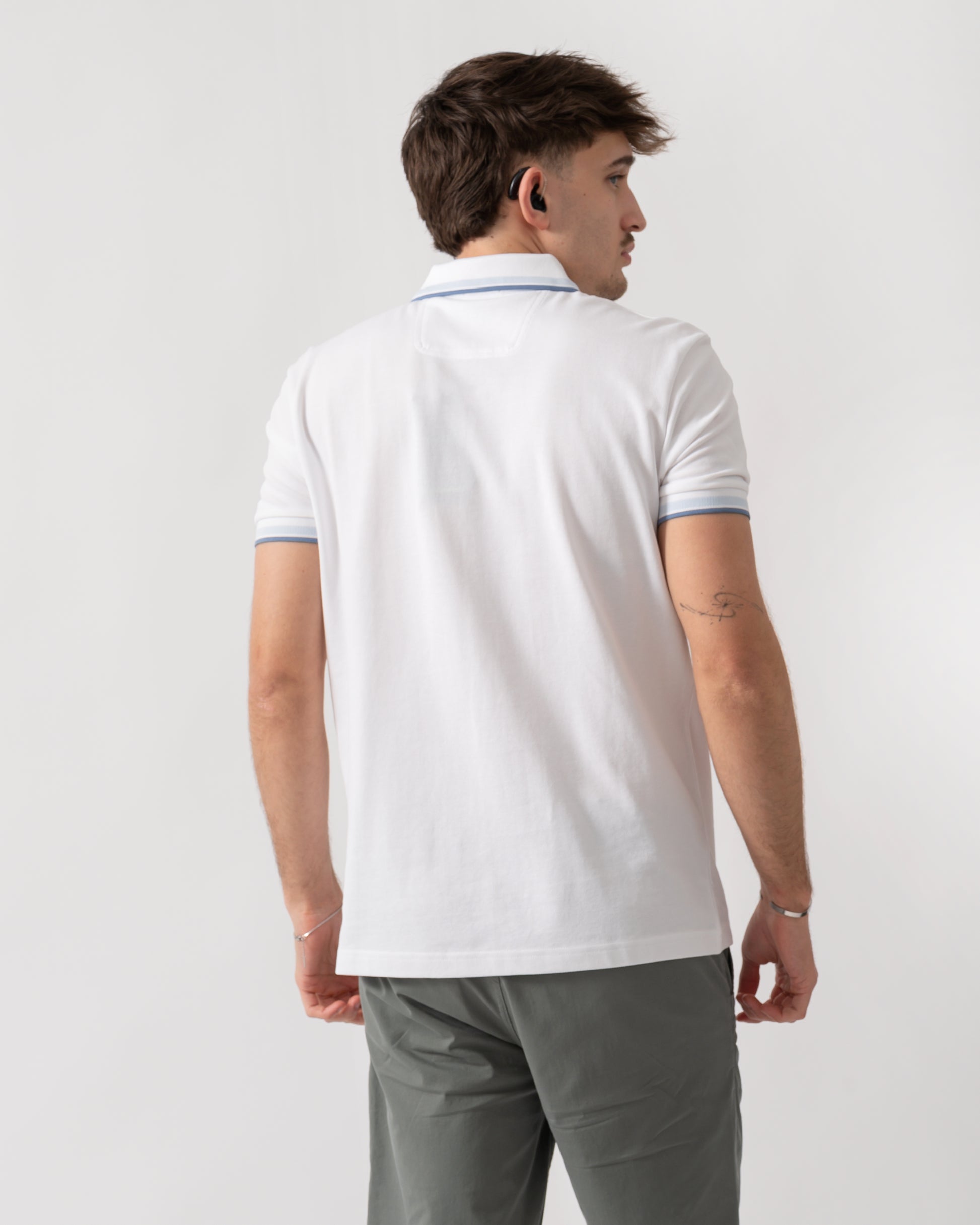 back shot of a model wearing a BOSS Green Paddy Mens Cotton-Piqué Polo Shirt with Contrast Logo in Open White 115