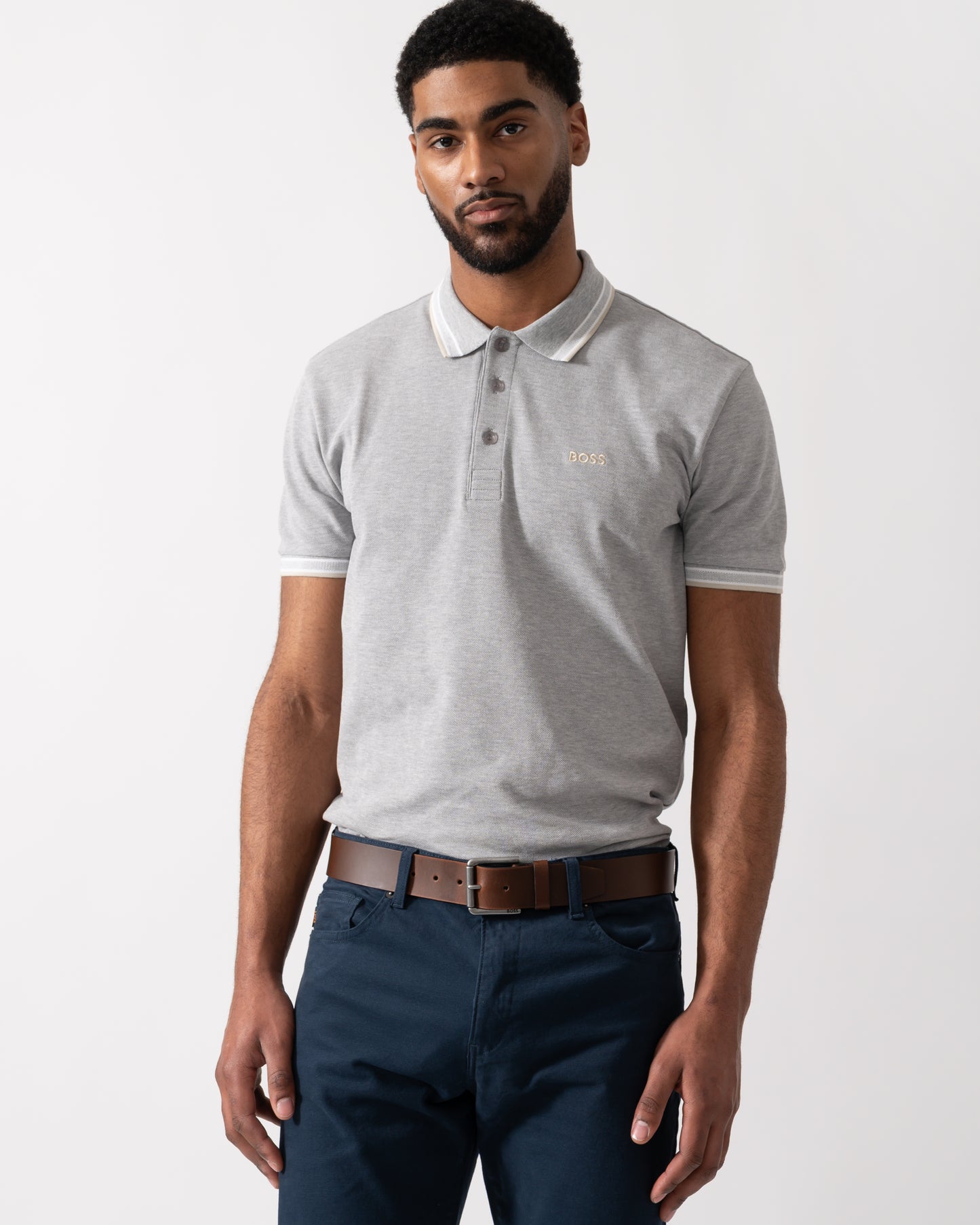 Model wearing a BOSS Green Paddy Mens Cotton-Piqué Polo Shirt with Contrast Logo in Silver