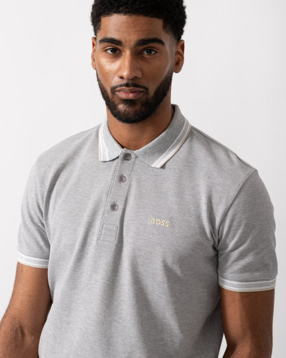 Close up shot of a Model wearing a BOSS Green Paddy Mens Cotton-Piqué Polo Shirt with Contrast Logo in Silver