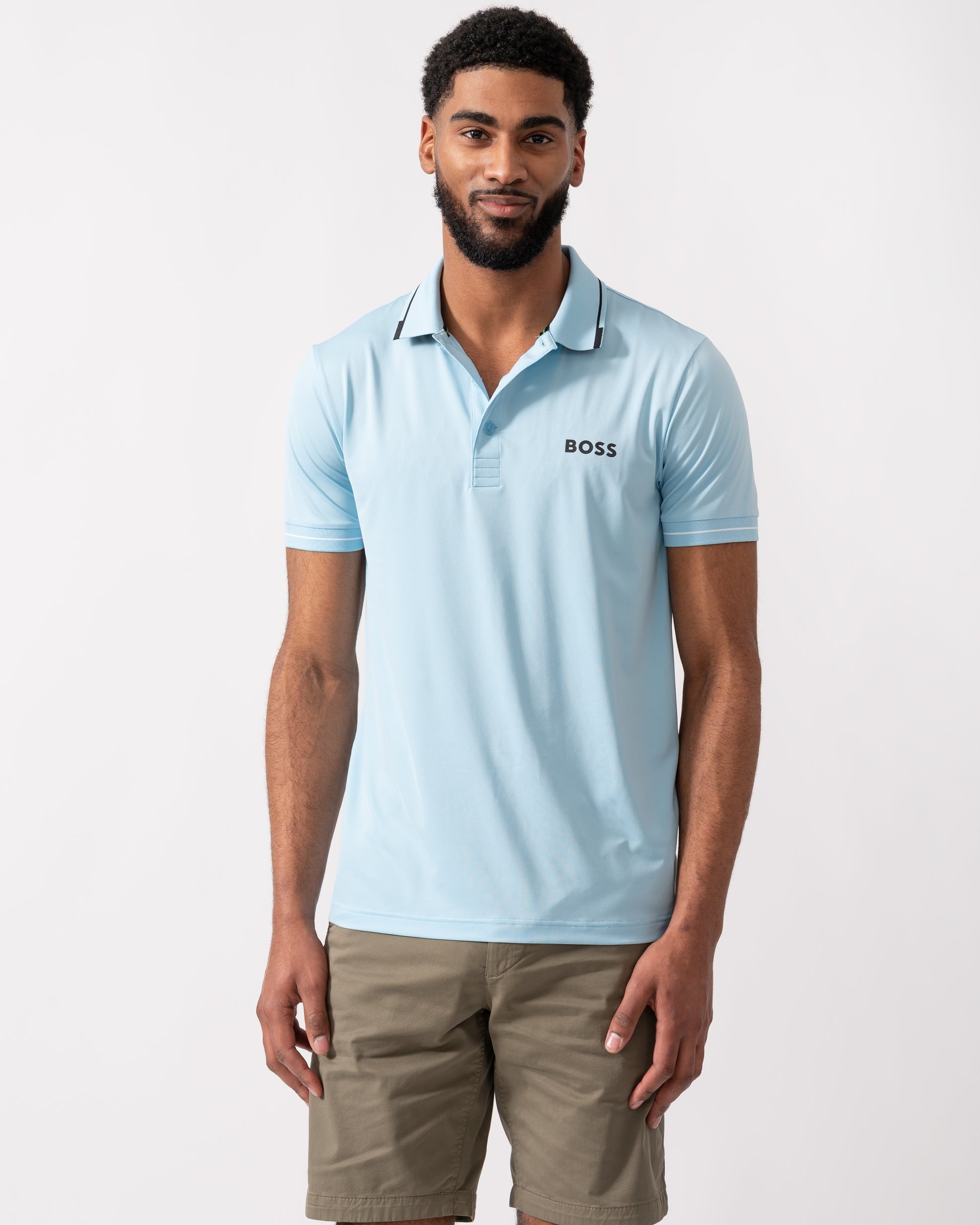 model wearing a BOSS Green Paul Pro Mens Tipped Polo Shirt in Light Pastel Blue