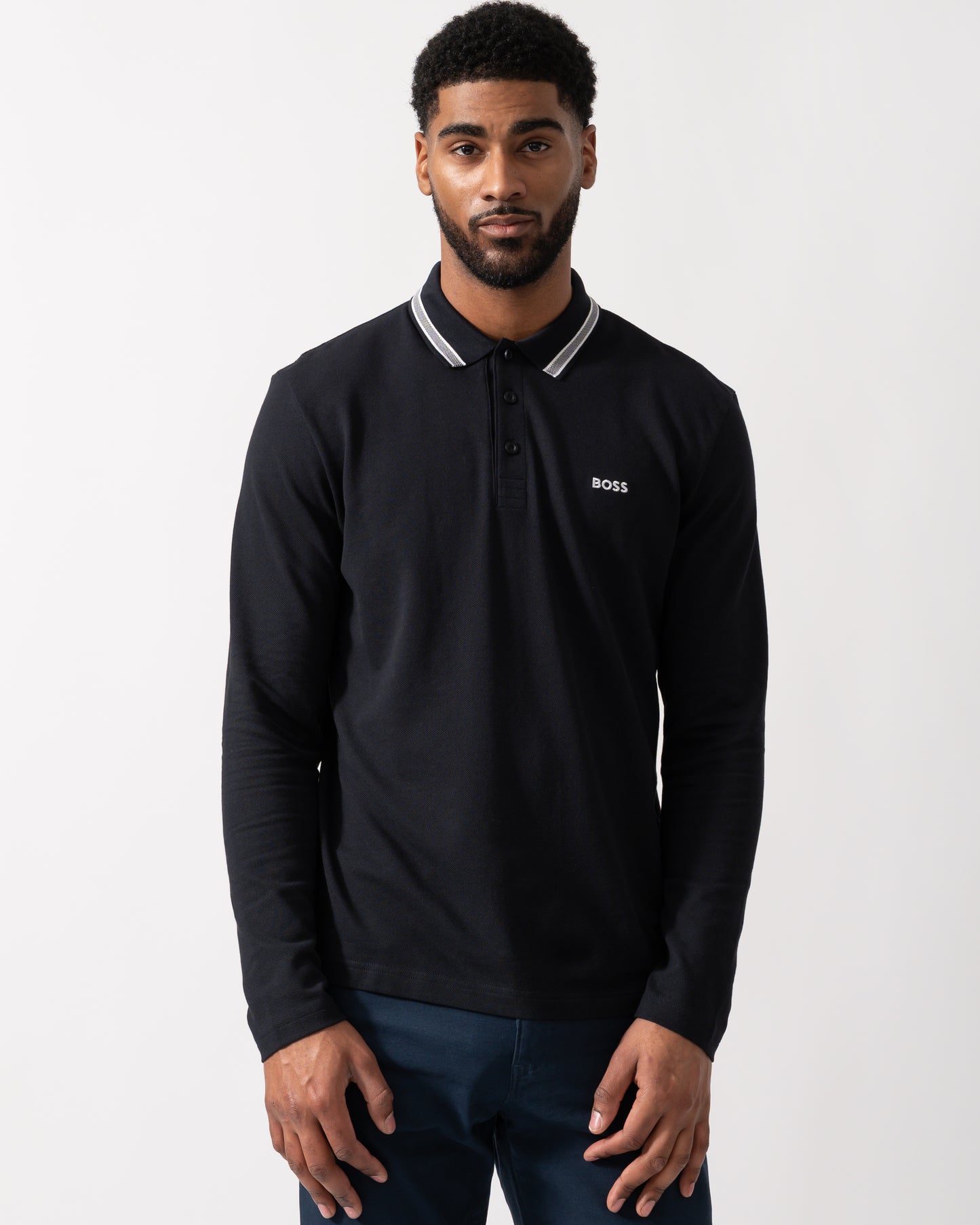 Model wearing a BOSS Green Plisy Mens Long Sleeve Polo Shirt in Dark Blue
