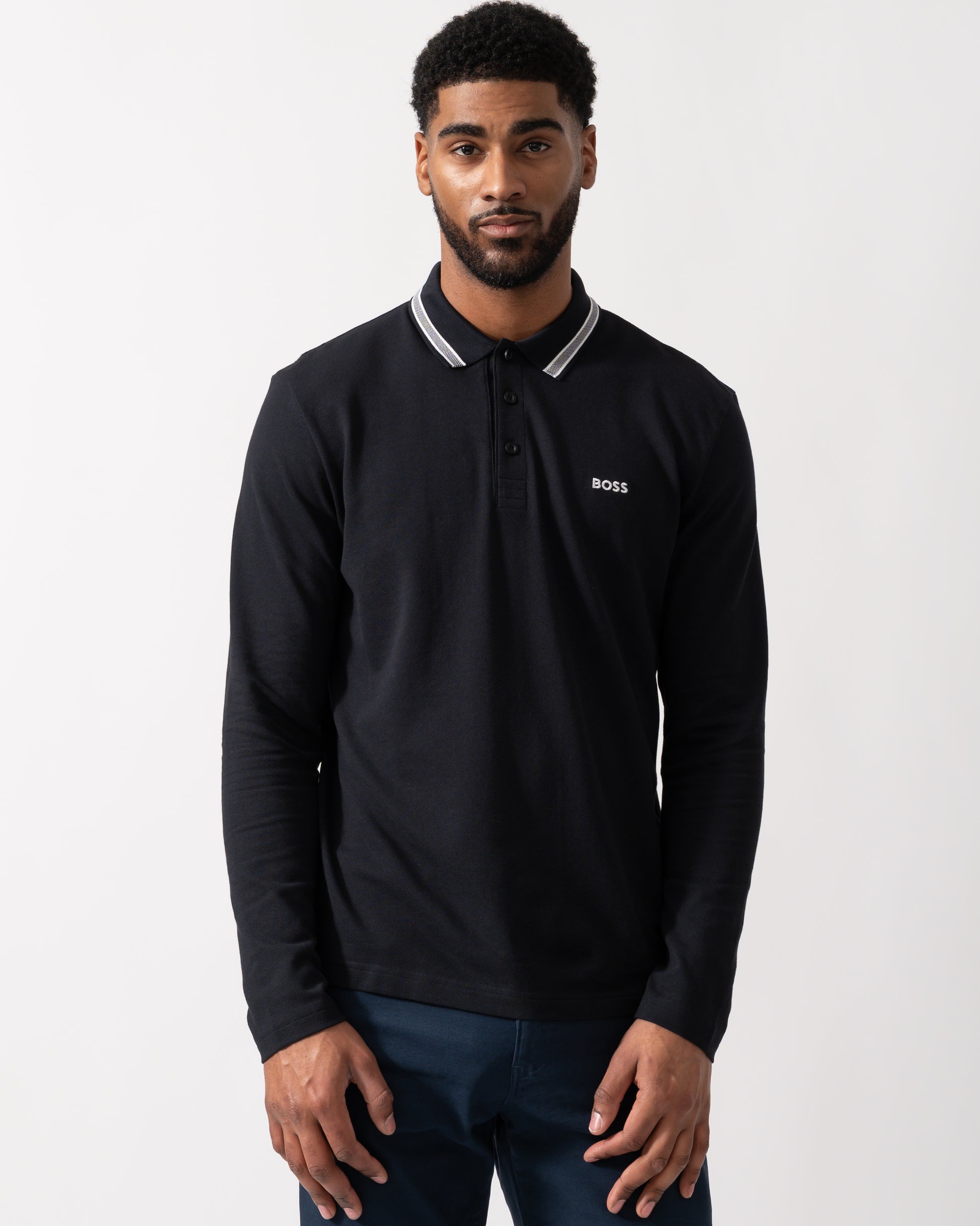 Model wearing a BOSS Green Plisy Mens Long Sleeve Polo Shirt in Dark Blue