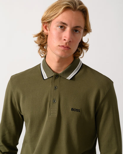 close up of model wearing a BOSS Green Plisy Mens Long Sleeve Polo Shirt in Open Green 398