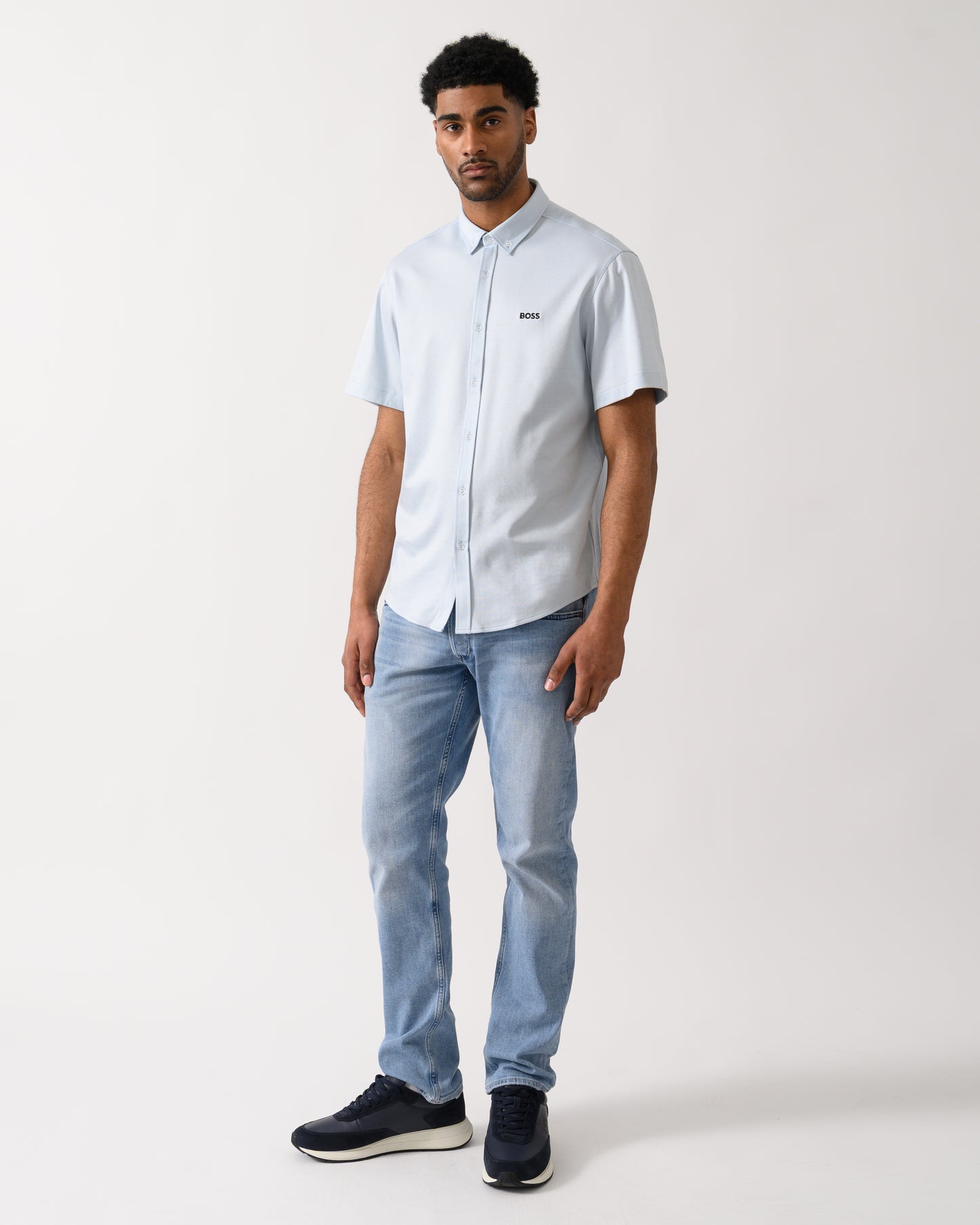 full lenght shot of a model wearing a BOSS Green ST_Motion Mens Short Sleeve Shirt in Open Blue 460